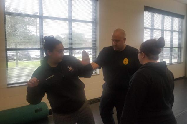 Employees training in self-defense