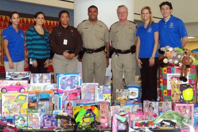 Pictured from L to R:  Ludivina Grace, Ana Mullins, Deputy Domitila Guerra, Deputy Frank Davis, Lt. Lester Phipps, Kristel Varnell, and Julio Corona.
